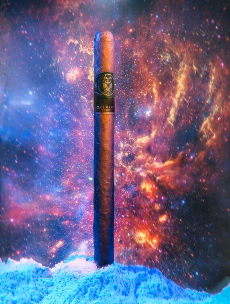 The Odyssey cigar against a cosmic nebula backdrop